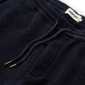 material shot of the drawcord and elasticated waist on The Apres Short in Indigo Waffle
