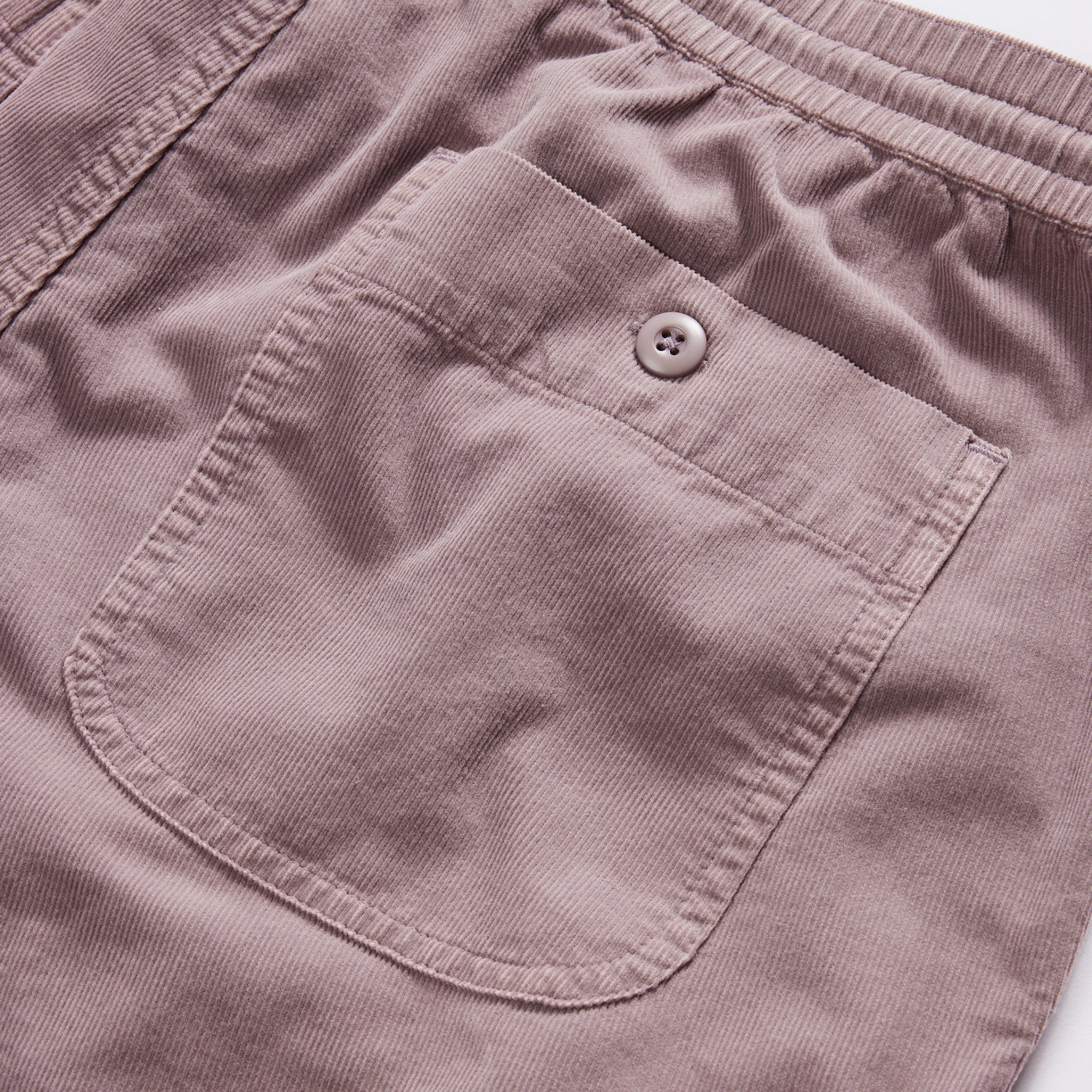 material shot of the back pocket on The Apres Short in Poppy Seed Micro Cord, Bottoms by Taylor Stitch