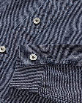 material shot of the YKK hardware on The Long Haul Jacket in Washed Indigo Stripe, Outerwear by Taylor Stitch