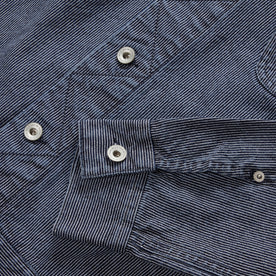 material shot of the YKK hardware on The Long Haul Jacket in Washed Indigo Stripe