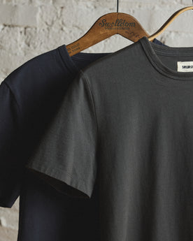 material shot of the sleeve on The Organic Cotton Tee in Faded Black, Knits by Taylor Stitch