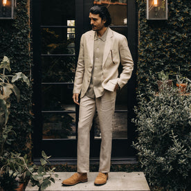 fit model standing by a doorway in The Sheffield Sport Coat in Natural Linen