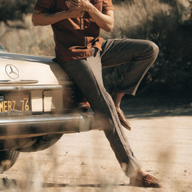 fit model sitting on a vintage Mercedes in The Sheffield Trouser in Cocoa Linen