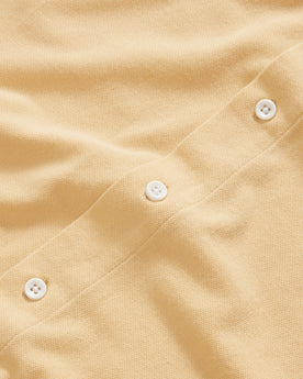 material shot of the natural buttons on The Short Sleeve California in Oak Pique, Knits by Taylor Stitch