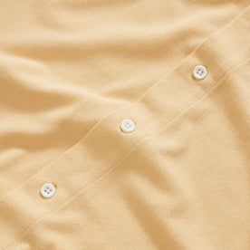 material shot of the natural buttons on The Short Sleeve California in Oak Pique