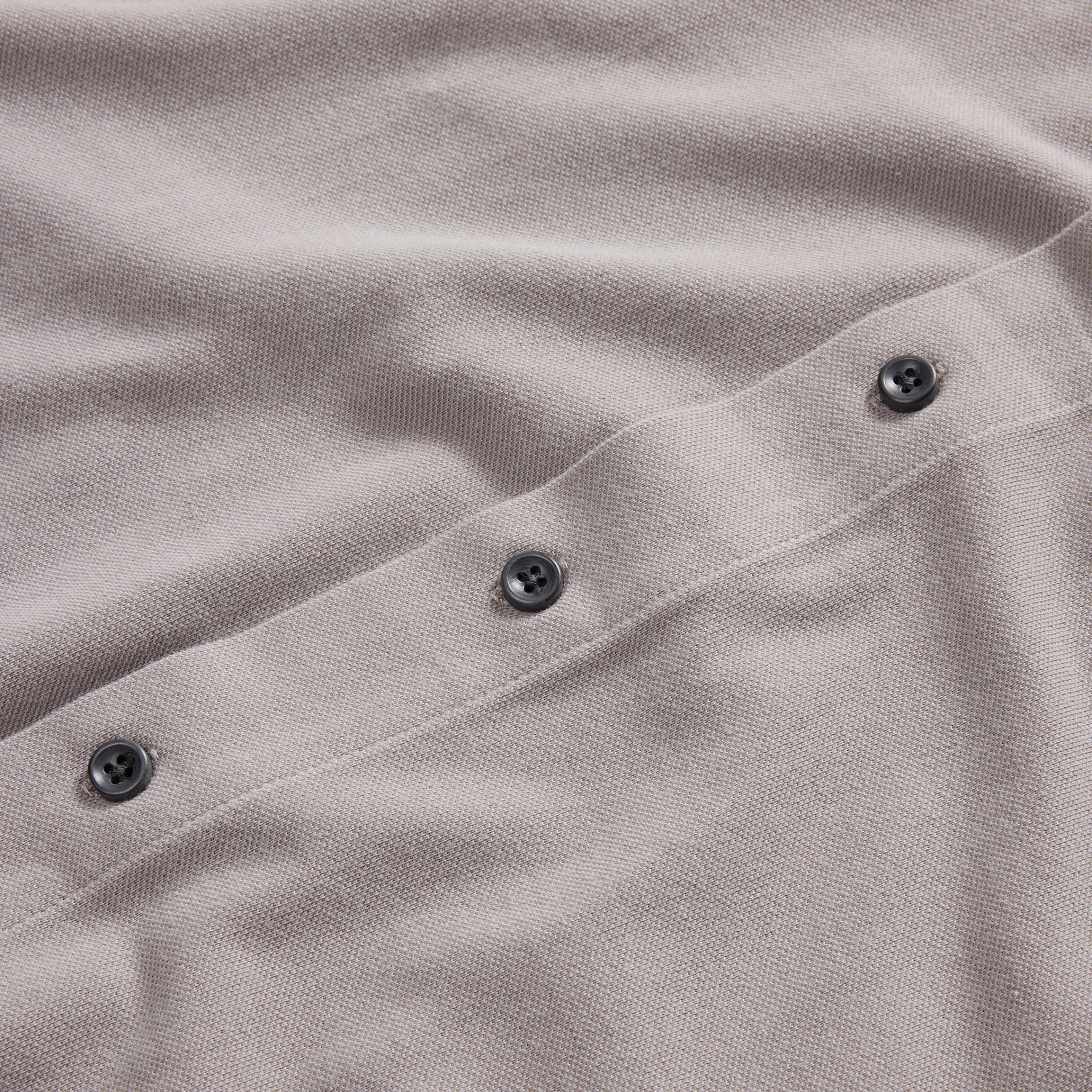 material shot of the burnt corozo buttons on The Short Sleeve California in Steeple Grey Pique, Knits by Taylor Stitch