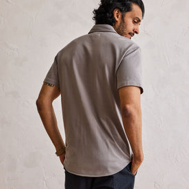 fit model showing the back of The Short Sleeve California in Steeple Grey Pique