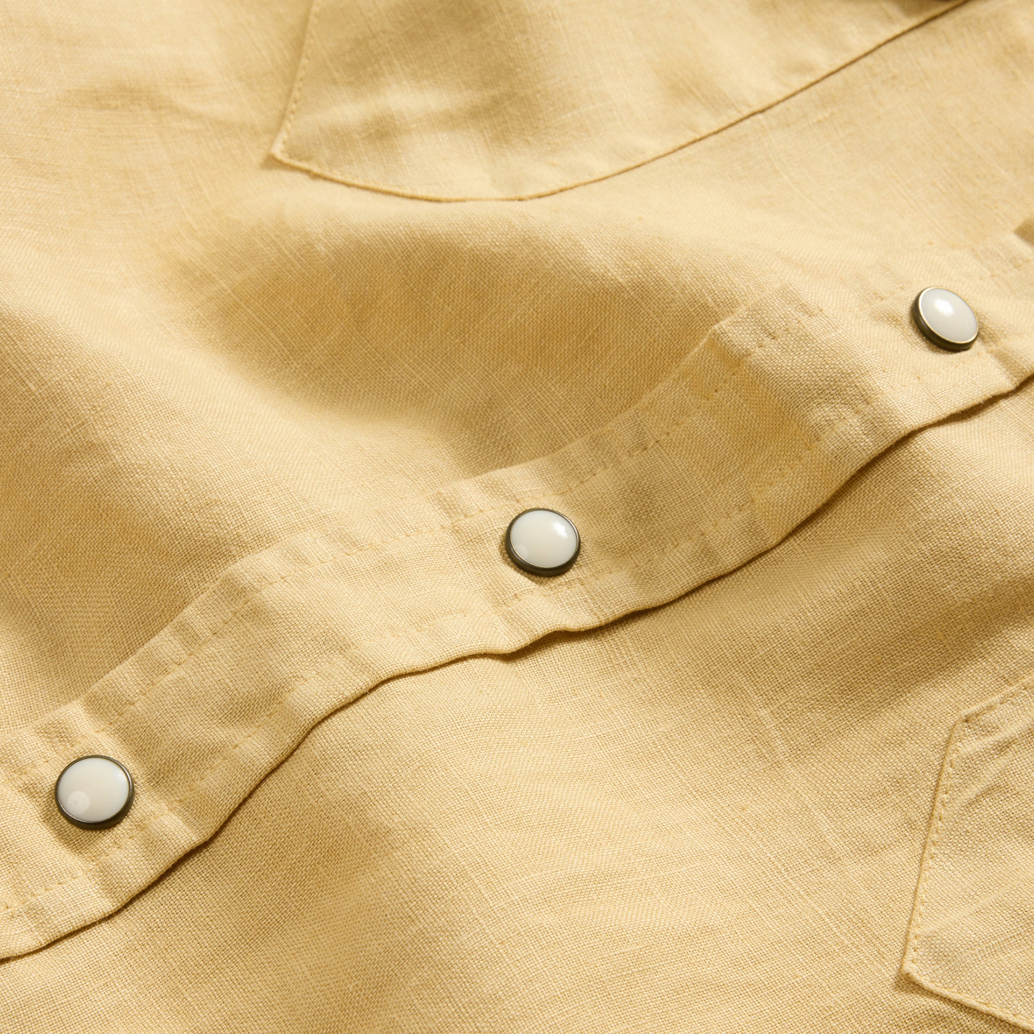 material shot of the snap buttons on The Short Sleeve Western in Oak, Wovens by Taylor Stitch