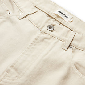 material shot of the button fly on The Slim All Day Pant in Dune Canvas