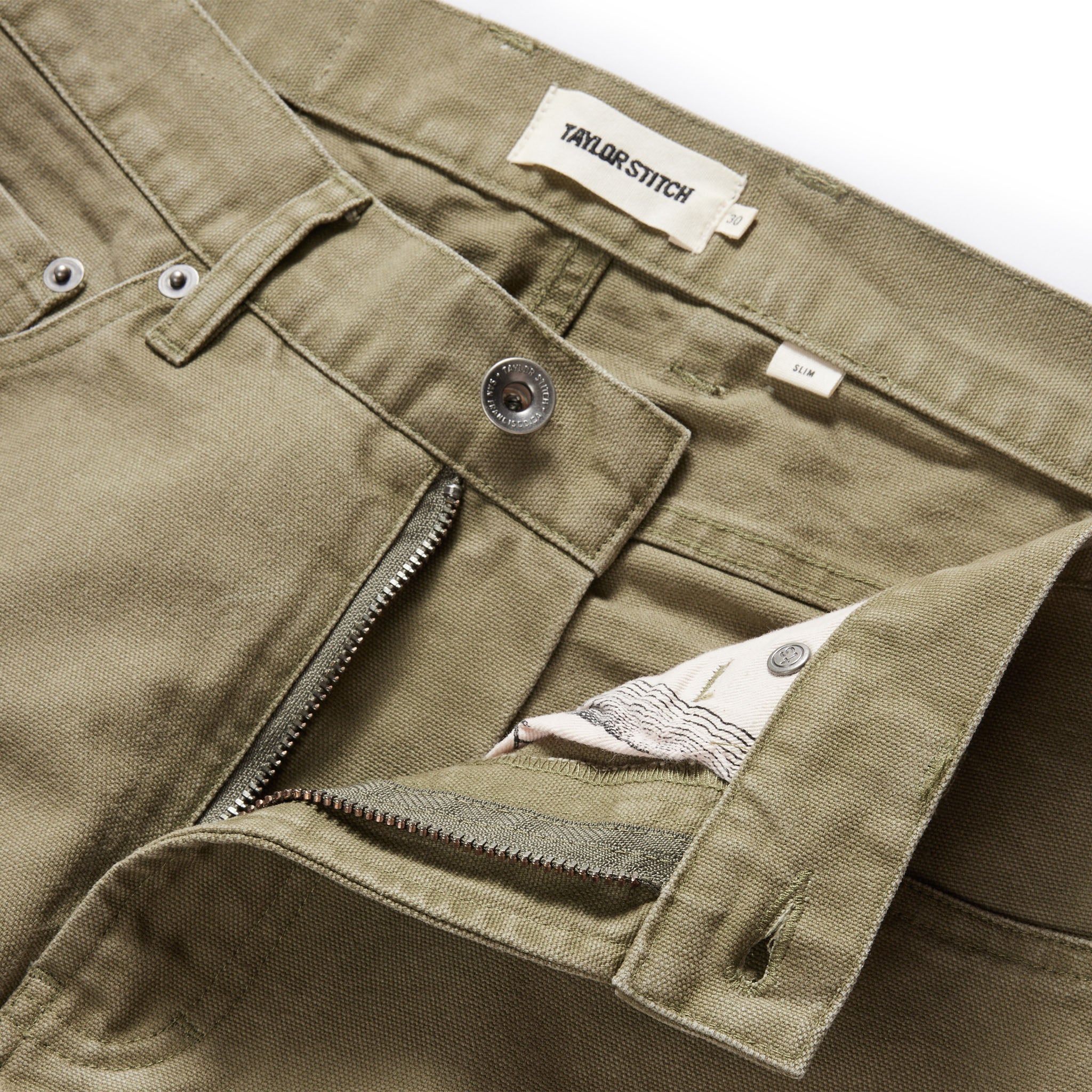 material shot of the button fly undone on The Slim All Day Pant in Arid Eucalyptus Canvas, Bottoms by Taylor Stitch
