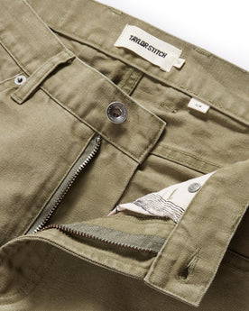 material shot of the button fly undone on The Slim All Day Pant in Arid Eucalyptus Canvas, Bottoms by Taylor Stitch
