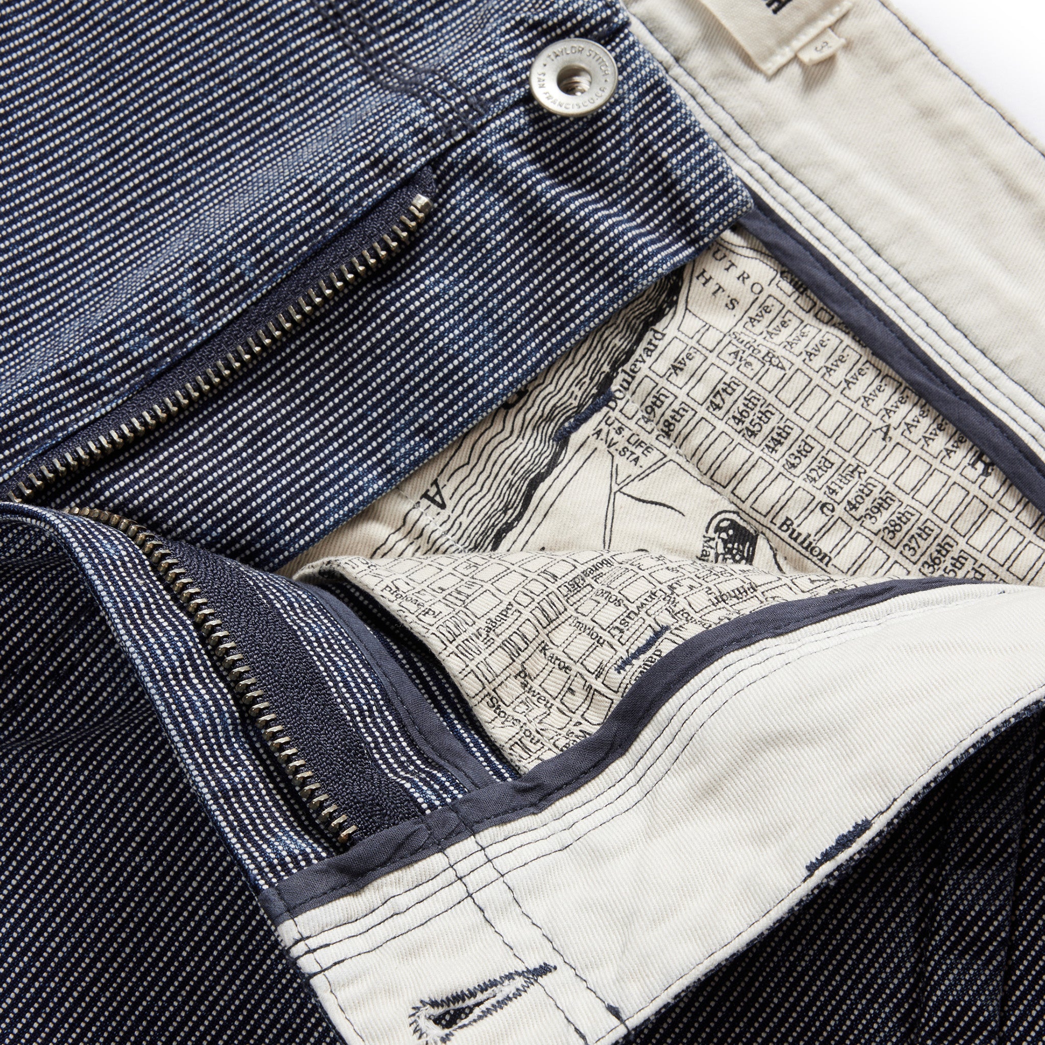 material shot of the zip fly undone on The Morse Pant in Washed Indigo Stripe, Bottoms by Taylor Stitch