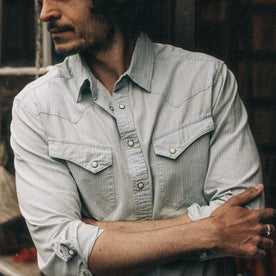 fit model showing the front of The Western Shirt in Bleached Indigo Stripe