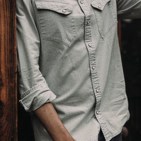 fit model wearing The Western Shirt in Bleached Indigo Stripe with rolled up sleeves