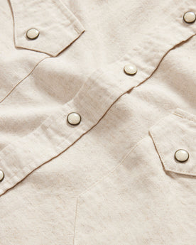 material shot of the buttons and front pockets on The Western Shirt in Natural, Wovens by Taylor Stitch