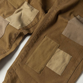 material shot of The Atelier and Repairs Chino in British Khaki, patches on front