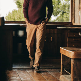 fit model wearing The Camp Pant in Tobacco Boss Duck, inside, walking, Bottoms by Taylor Stitch