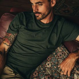 Fit Model wearing tee shirt on couch