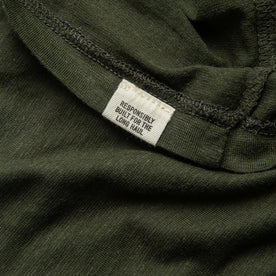 material shot of tag on hem of tee shirt