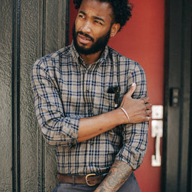 fit model wearing The Jack in Sand Plaid, looking left