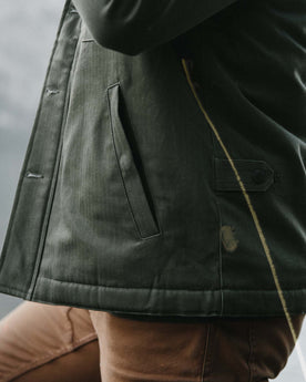 fit model showing quarter top pocket profile of The Lined Watts Jacket in Olive, Outerwear by Taylor Stitch