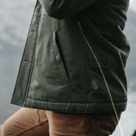 fit model showing quarter top pocket profile of The Lined Watts Jacket in Olive