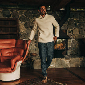fit model wearing The Nomad Hoodie in Natural Twill inside with apres pants