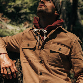 fit model wearing The Shop Shirt in Tobacco Boss Duck, looking up