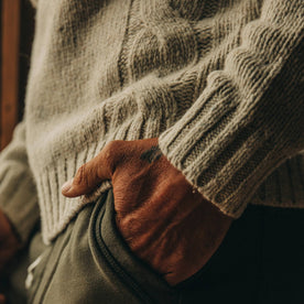 fit model wearing The Topside Sweater in Natural Cable Knit, hand in pocket