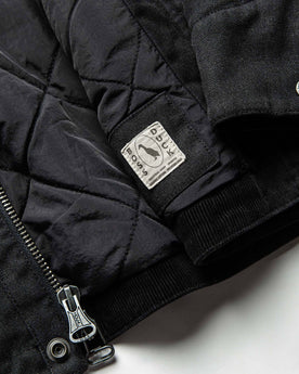 material shot of boss duck logo, Outerwear by Taylor Stitch