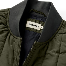 material shot of the neck opening on The Able Vest in Quilted Army