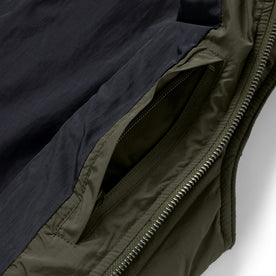 material shot of the interior pocket on The Able Vest in Quilted Army