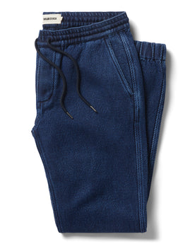 flatlay of The Apres Pant in Indigo Cross Dye folded, Bottoms by Taylor Stitch