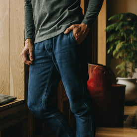 fit model with his hand in his pocket of The Apres Pant in Indigo Cross Dye