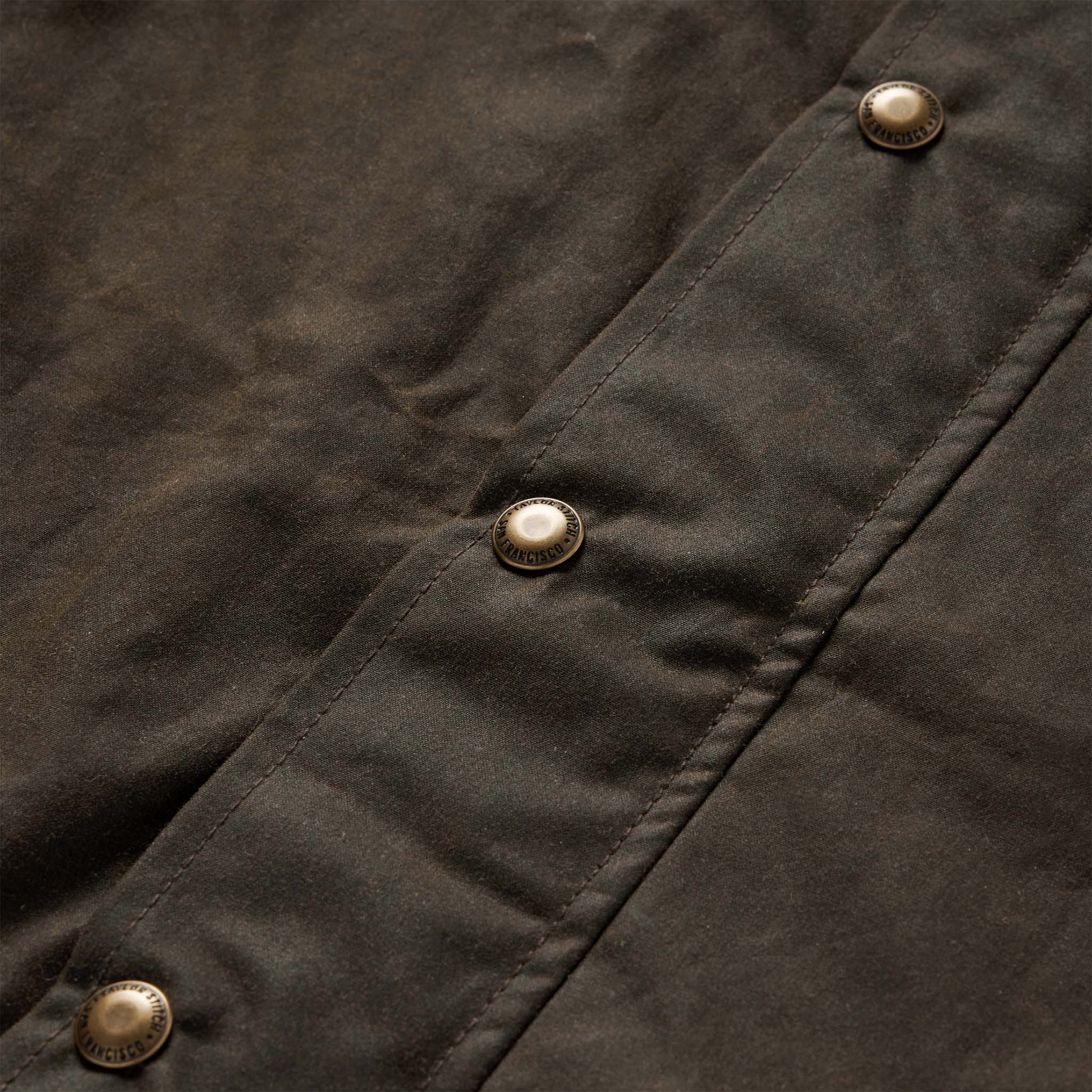 material shot of the buttons on The Bomber Jacket in Bark EverWax, Outerwear by Taylor Stitch