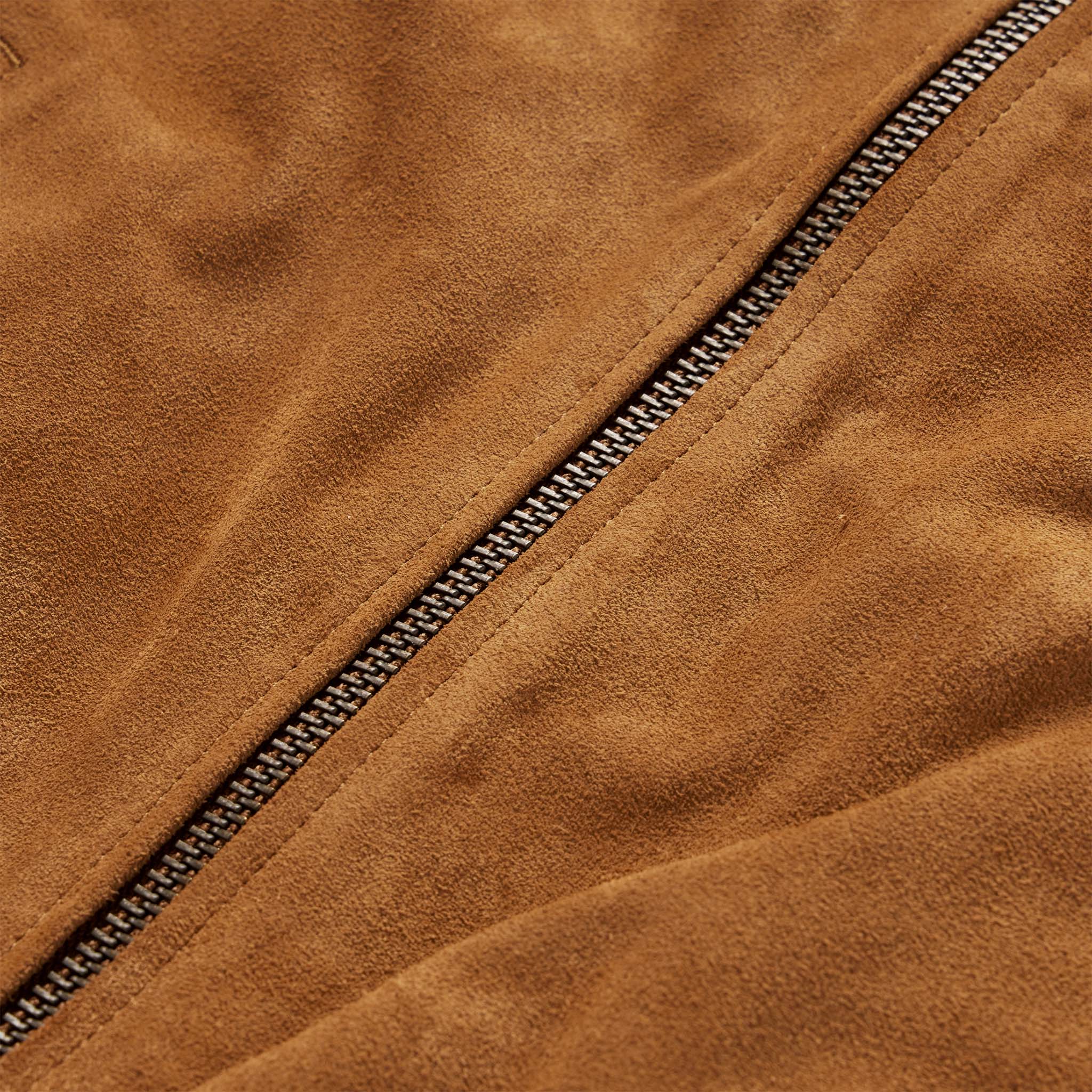 material shot of the zipper on The Bomber Jacket in Sierra Suede, Outerwear by Taylor Stitch