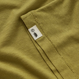 material shot of the TS tag on the sleeve of The Cotton Hemp Tee in Juniper