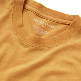 material shot of the collar on The Cotton Hemp Tee in Mustard