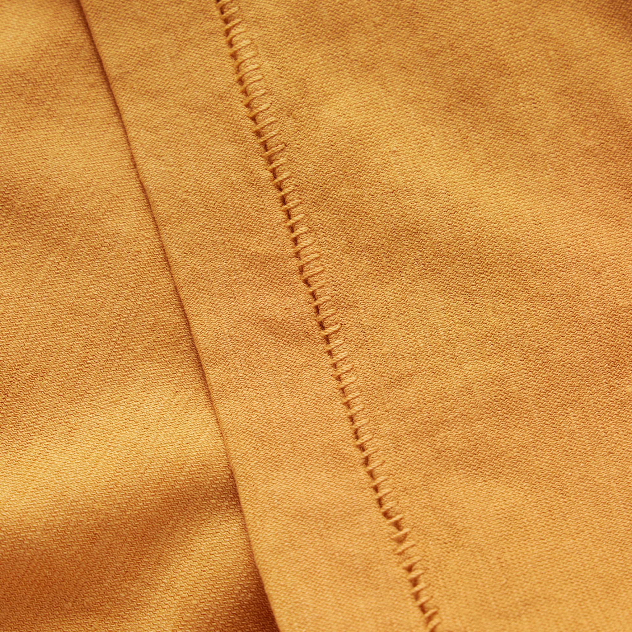 material shot of the sleeve on The Cotton Hemp Tee in Mustard, Knits by Taylor Stitch