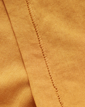material shot of the sleeve on The Cotton Hemp Tee in Mustard, Knits by Taylor Stitch