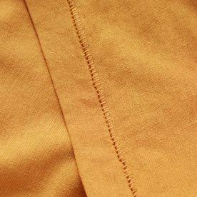 material shot of the sleeve on The Cotton Hemp Tee in Mustard