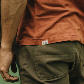 fit model showing the back of The Cotton Hemp Tee in Copper