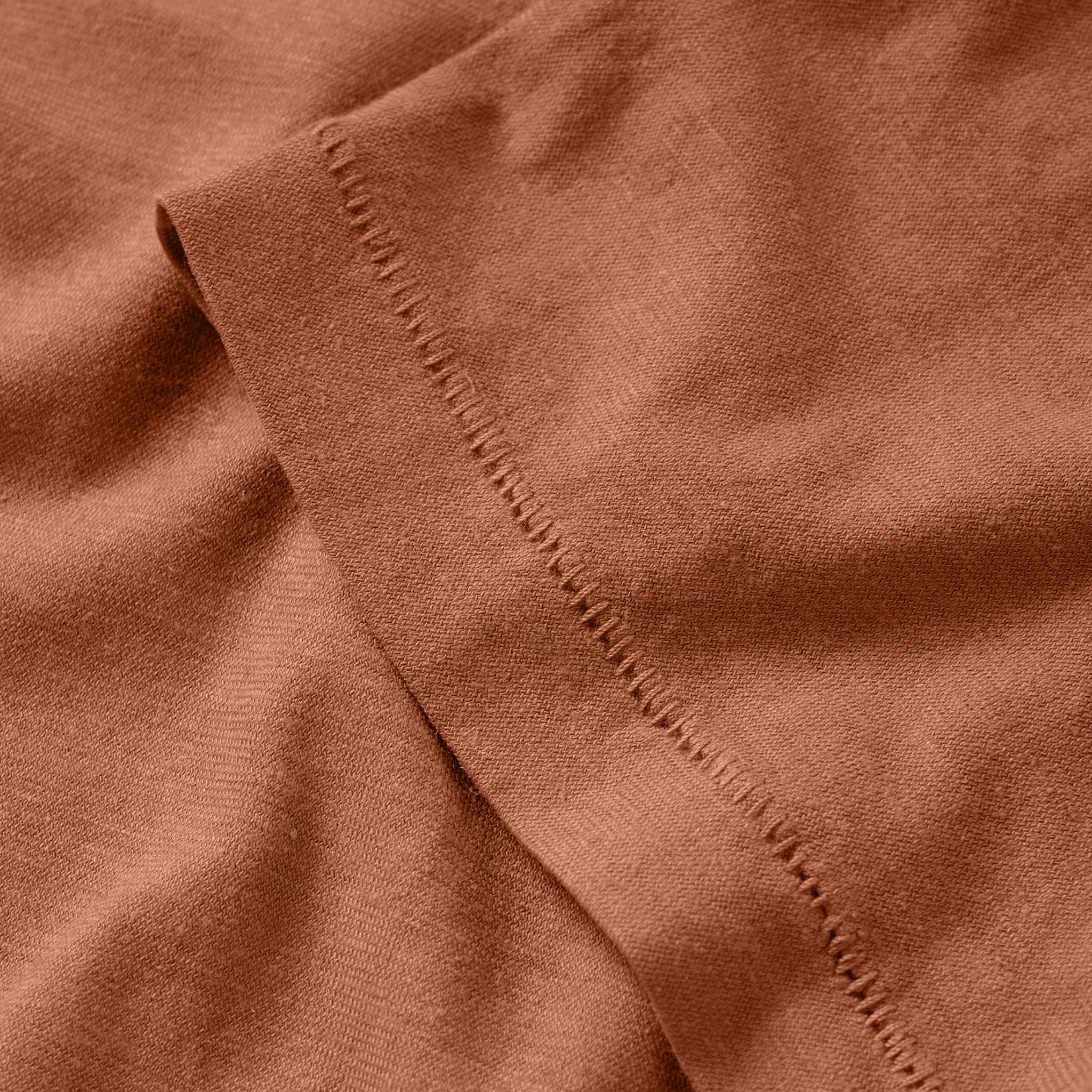 material shot of the sleeve on The Cotton Hemp Tee in Copper, Knits by Taylor Stitch