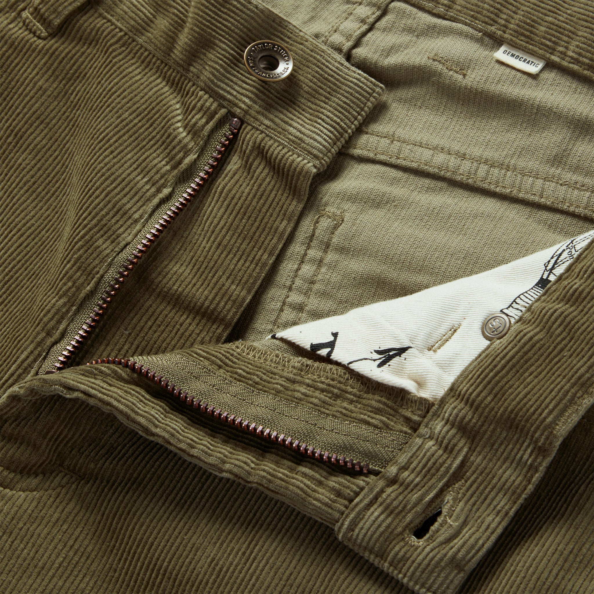 material shot of the zip fly on The Democratic All Day Pant in Cypress Cord, Bottoms by Taylor Stitch