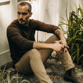 fit model sitting in The Lodge Sweater in Coffee