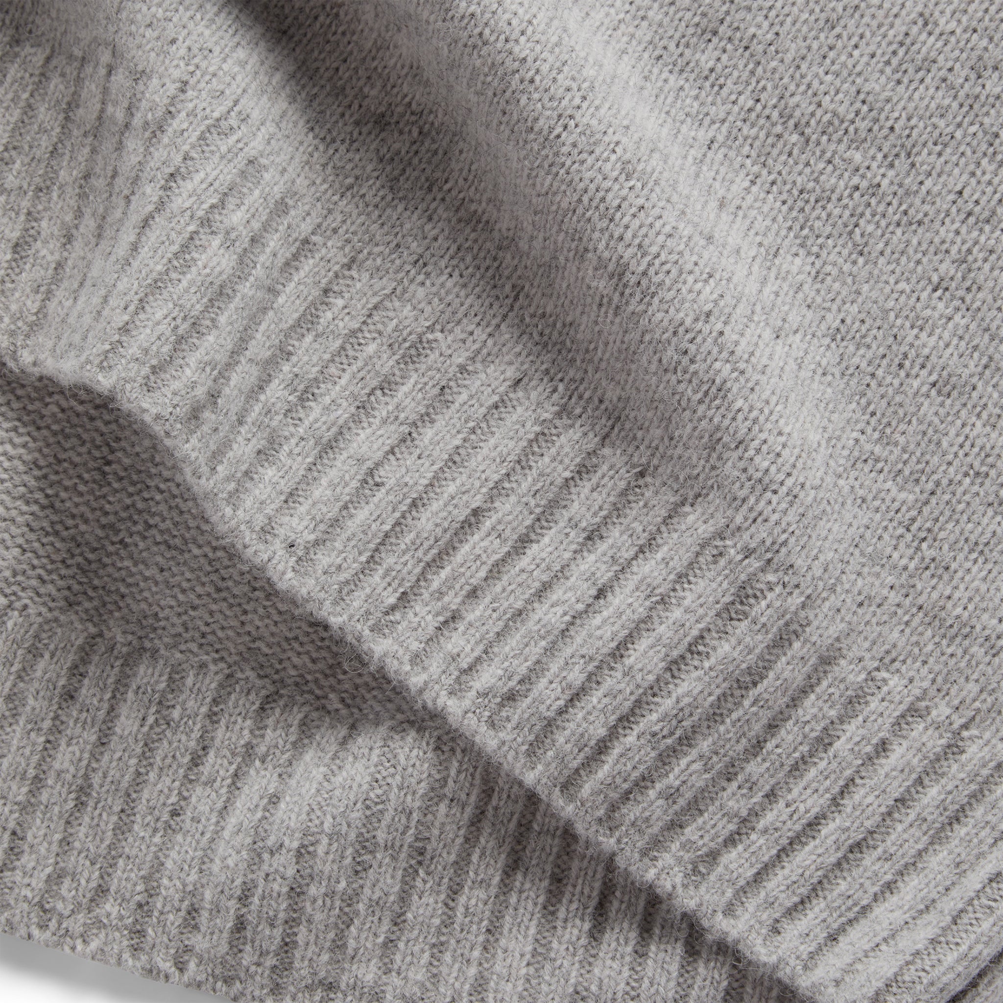 material shot of the hem on The Lodge Sweater in Heather Grey, Knits by Taylor Stitch