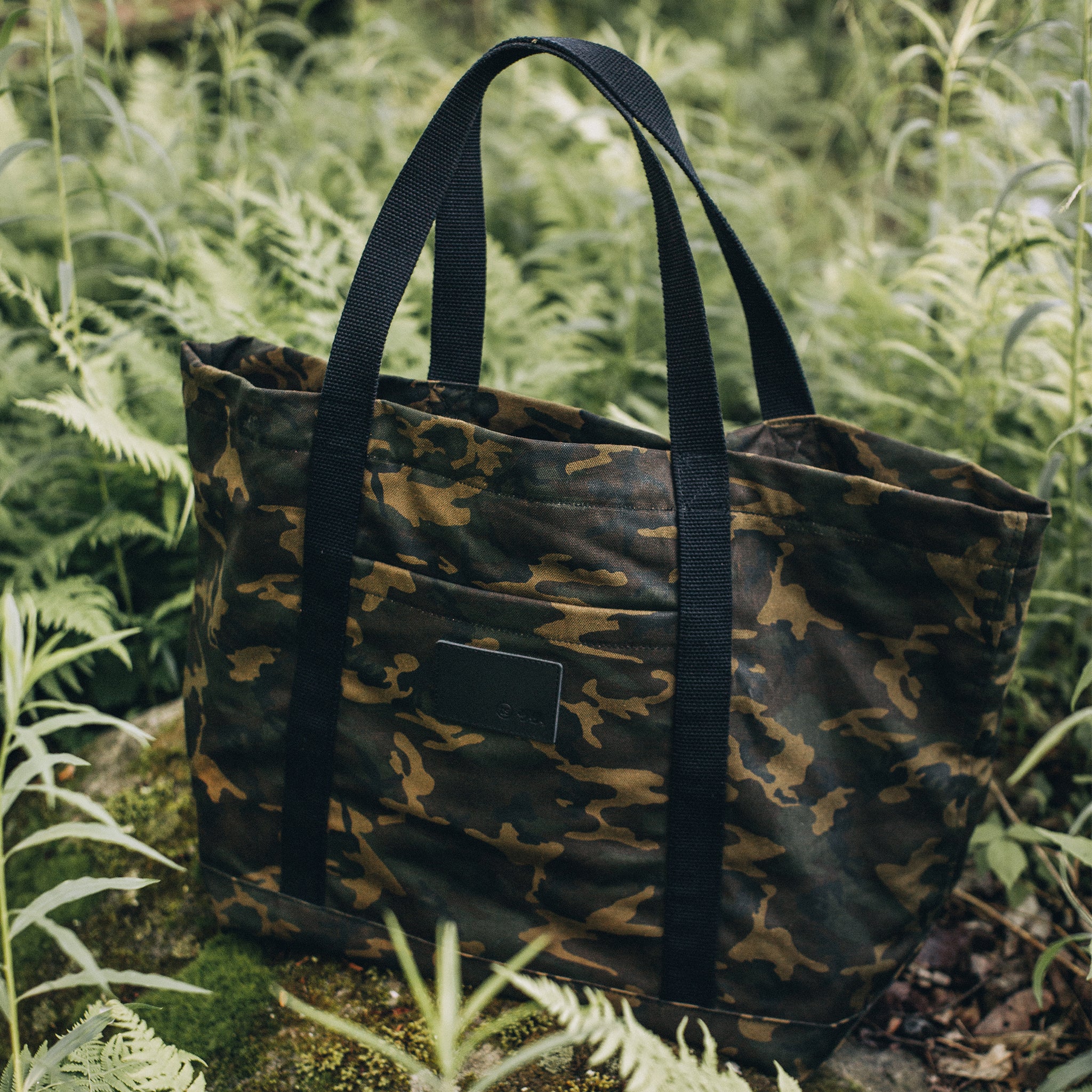 flatlay of The Market Tote in Camo Boss Duck, among ferns, Accessories by Taylor Stitch