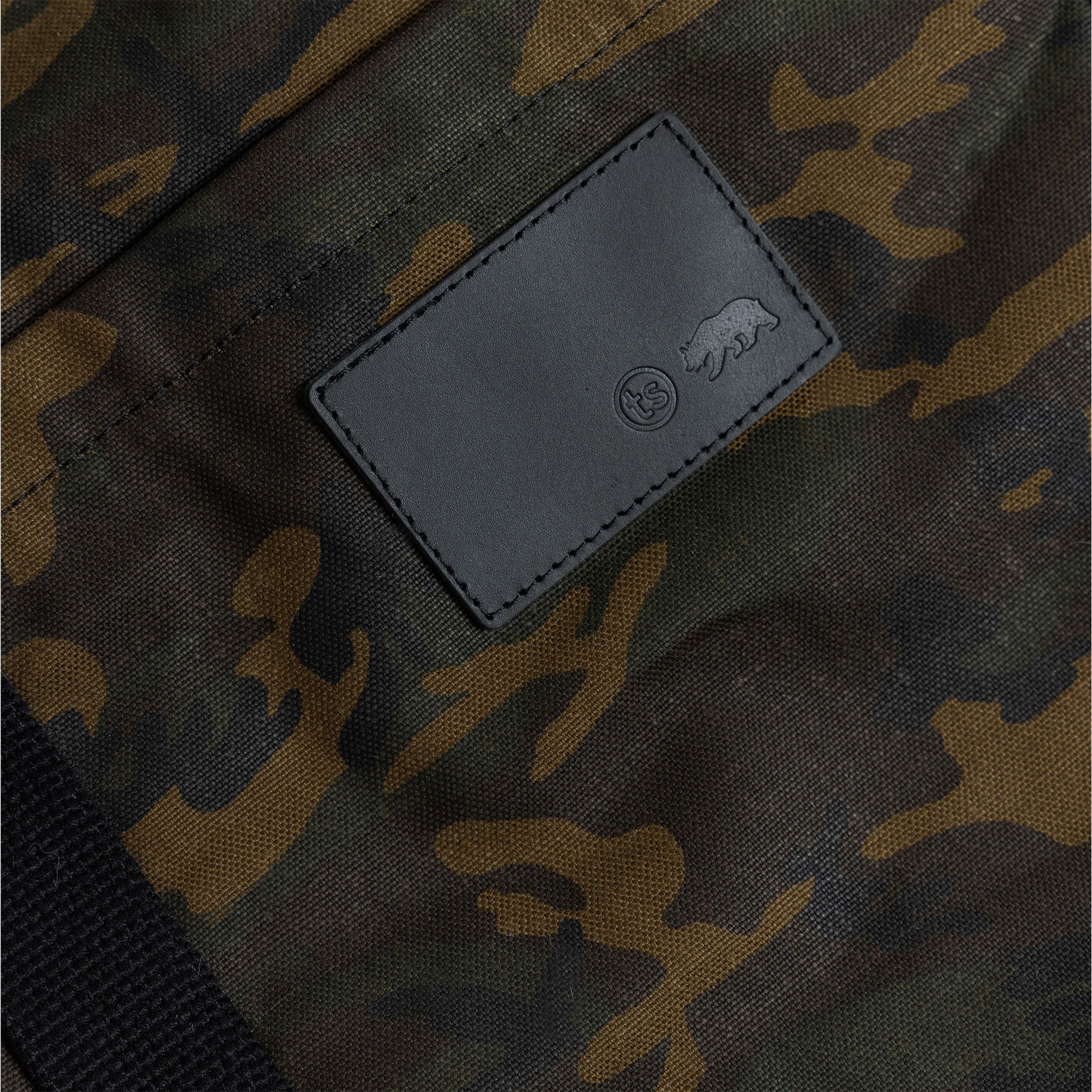 material shot of the leather patch on The Market Tote in Camo Boss Duck, Accessories by Taylor Stitch