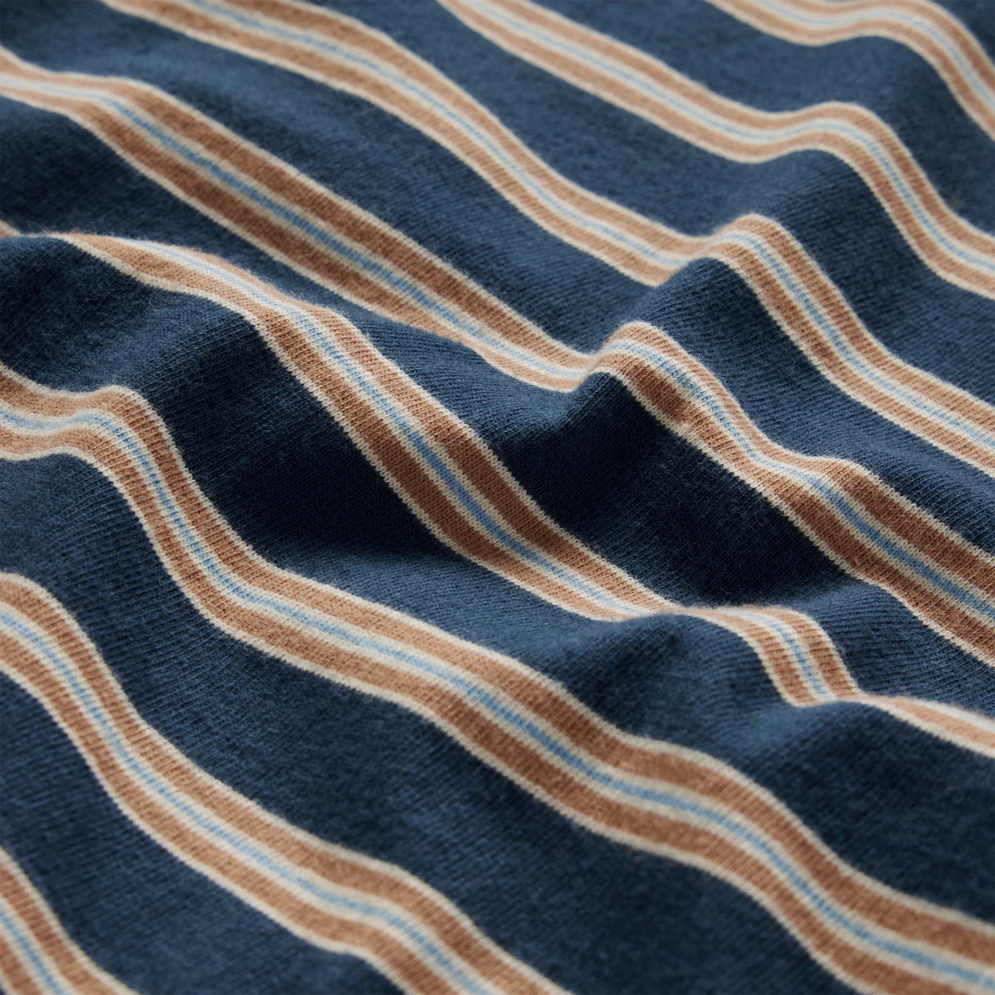 material shot showing the stripes on The Organic Cotton Tee in Deep Sea Stripe, Knits by Taylor Stitch