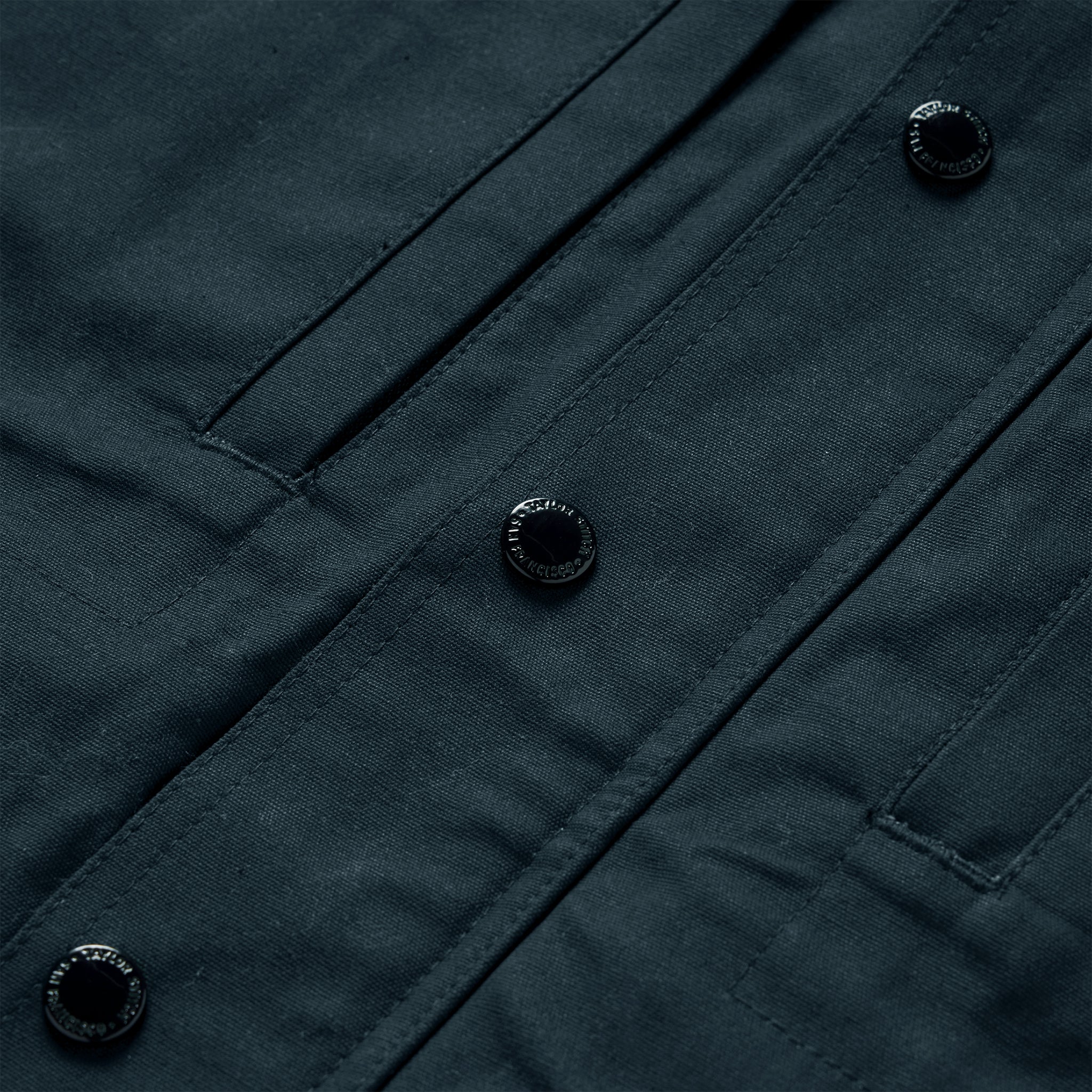 material shot of the buttons on The Pathfinder Jacket in Navy Dry Wax, Outerwear by Taylor Stitch